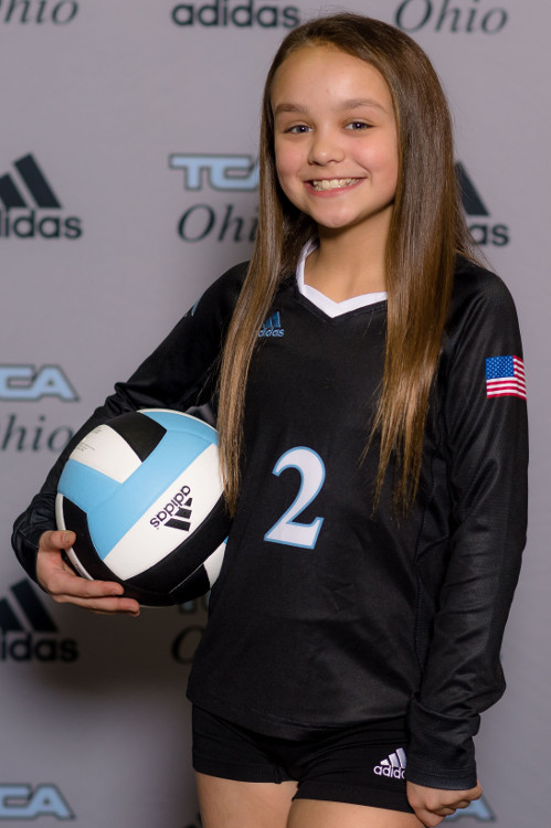 Club volleyball individual photo with backdrop